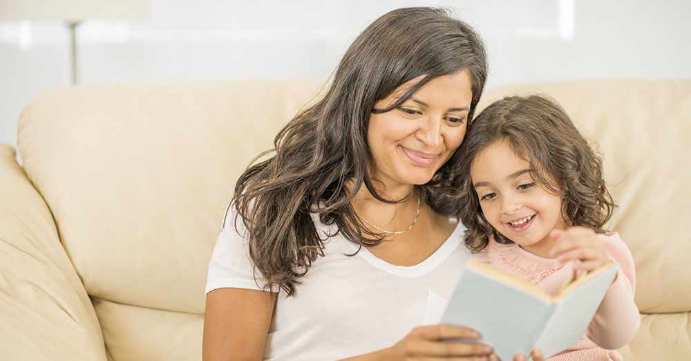 Photo of mother reading with child